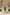 Mensfuel Creamy Facewash 150ml pump bottle on a beige podium surrounded by green plants